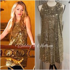 a gold sequinned dress on display next to a mannequin with an image of a woman in it