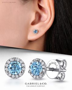 Each of these timeless 0.32ct swiss Blue Topaz stud earrings features a vivid round cut center stone encircled by a striking halo of shimmering 0.036ct pavé diamonds. These wear-anywhere earrings are sure to become a jewelry box favorite. EG12372W45BT #gabrieljewelry #gabrielnecklace #gabrielring #gabrielearrings #gabrielbracelet #GabrielNY #DiamondJewelry #FineJewelry #GabrielAndCo #UniqueJewelry #Jewelry #FashionJewelry #GiftIdeas #UniqueGifts #Earrings #WhiteGoldEarrings #BlueTopaz Gabriel Jewelry, Amethyst Studs, Color Earrings, Colored Stones, Three Stone Engagement, Gemstones Jewelry, Three Stone Engagement Rings, White Gold Earrings, Swiss Blue Topaz