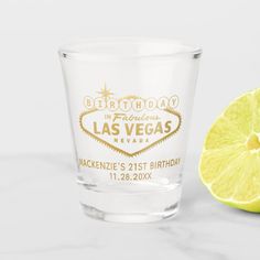 a shot glass with the words save the date printed on it next to a lemon