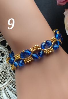 a close up of a person's arm wearing a bracelet with blue glass beads