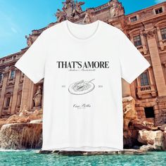 Celebrate love and friendship with our personalized Italy-themed Bachelorette Party T-Shirt! Perfect for a bride and her squad headed to the enchanting streets of Italy, this shirt features the charming phrases "That's Amore," "(Bride's Name)'s Bachelorette," the year, "Ciao Bella," and your choice of location in Italy. On the back, "Amore and Vino" adds a touch of romance, making this shirt the ideal keepsake for an unforgettable celebration. Please note: Due to the personalized nature of this Crew Neck T-shirt For Anniversary In Summer, Summer Anniversary Crew Neck T-shirt, Summer Crew Neck T-shirt For Anniversary, Crew Neck Graphic Print Top For Honeymoon, Graphic Print Crew Neck Top For Honeymoon, Trip Italy, Personalized Bachelorette, Party T Shirts, Italy Street