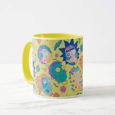 a yellow coffee mug with cartoon characters on it