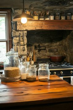 the kitchen counter is covered with jars and spices