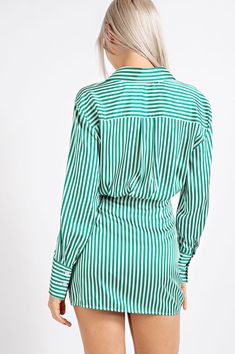 Elevate your style with our Stripe Satin Shirt Dress in stunning green. This stylish shirt dress is crafted from silky satin fabric, adorned with a cool stripe pattern that adds a trendy flair to your wardrobe. The relaxed fit and classic shirt collar create a comfortable and versatile look, making it suitable for a wide range of occasions. Whether you choose to dress it up or down, this satin shirt dress is designed to turn heads and become a staple in your wardrobe. Its striking green color ad Chic Vertical Stripe Shirt Dress, Chic Long Sleeve Vertical Stripe Shirt Dress, Chic Long Sleeve Shirt Dress With Vertical Stripes, Chic Striped Button-up Shirt Dress, Elegant Green Shirt Dress For Work, Elegant Green Button-up Shirt Dress, Chic Green Long Sleeve Shirt Dress, Green Collared Shirt Dress For Work, Chic Green Shirt Dress For Spring