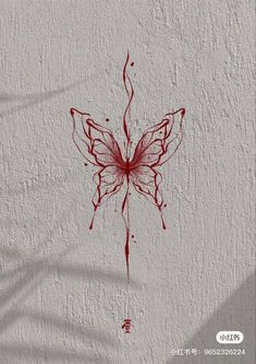 a drawing of a red butterfly on a white wall with the shadow of a plant