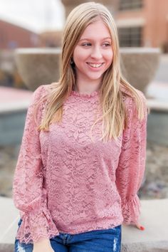 The sweetheart lacy top is absolutely perfect. No really, we can't get over the detailed lace on this top and those cute little lace bell cuffs and ruffle neckline. Dress it up for that perfect office top or wear it with jeans. We think it works well with everything. Available in 3 colors: Black, Burgundy, Mauve Fits true to size. Michaela is wearing a small and Taya is wearing a medium. 90% Nylon, 10% Spandex Long sleeve, lace top with bell cuff, and ruffle lace neckline. Tops With Jeans, Ruffle Neckline Dress, Long Sleeve Lace Top, Office Top, Lacy Tops, Perfect Office, Neckline Dress, Lace Neckline, Walk By Faith