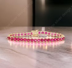 14k Gold Ruby Bracelet, Genuine Ruby Rounds White Gold Bracelet for Women, Gold Ruby Tennis Bracelet, July Birthstone, Anniversary Gift  Super chic bracelet, that is beautiful and minimalist. Brilliant Pink/Ruby cubic zirconia stones that sparkly so beautifully! This bracelet looks amazing layered or by itself. Adds a nice touch of sparkle, while still being classy Item Details Metal: 925 Sterling Silver Main stone creation- Ruby  (lab created) Main Stone Color: Red Main Stone Shape: cushion  St Gold Ruby Tennis Bracelet Gift, Gold Ruby Tennis Bracelet As A Gift, Gold Ruby Tennis Bracelet For Anniversary, Anniversary Gold Ruby Tennis Bracelet, Bracelet For Women Gold, Bracelet Tennis, Ruby Bracelet, Birthday Bracelet, Chic Bracelet