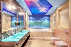 a bathroom with a sky mural on the ceiling