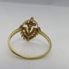 Estate wonderful vintage 18k yellow gold great condition i think is a old stick pin conversion. ruby seed pearl ring size 8. just fabulous. 1.6 grams. 16mm wide in front. estate 1910's beautiful uniique piece. unmarked acid tests for 18k. Antique Gold Ruby Ring Stamped 14k, Victorian Ruby Ring In Stamped 14k Yellow Gold, Antique 14k Stamped Yellow Gold Ruby Ring, Antique Gold Ruby Ring Hallmarked, Antique Gold Ruby Ring, Gold Ruby Ring With 17 Jewels For Wedding, Antique Gold Ruby Ring For Anniversary, Estate Style Oval Gold Jewelry, Vintage Gold Ruby Ring Collectible