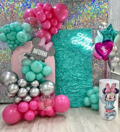 a table topped with balloons and other items