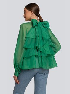 Composition: Chiffon, Polyester Washing instructions: Hand Wash Designer Style ID: GC123-52675 Introducing our Brandy Blouse - a vibrant and dramatic piece with layered ruffles, a high neck, statement sleeves, and gathered cuffs. The sheer, lightweight fabric offers a delicate balance of coverage and ease. Shown here in Green. Summer Ruffled Blouse For Layering, Summer Ruffle Blouse For Layering, Elegant Voluminous Tops With Ruffles, Elegant Voluminous Ruffled Tops, Elegant Voluminous Ruffled Blouse, Chic Green Ruffled Blouse, Chic Green Ruffled Tops, Summer Tiered Ruffle Blouse, Chic Green Tops With Ruffles