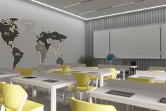 an empty classroom with yellow chairs and a world map on the wall