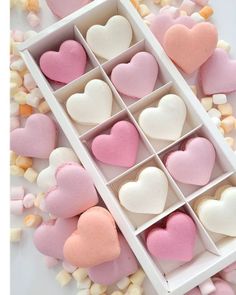 several heart shaped marshmallows in a white box