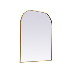 an arch shaped mirror on a white wall with a gold frame and metal trim around the edges