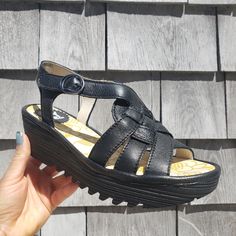 Fly London Wedge Sandals With Velcro Ankle Strap. Nwt, Us 6/ Eu 36 Fly London Footbeds Are Like None Other When It Comes To Comfort. These Are Regular Width. Questions? Leave A Comment Below! #Luxsummersandals #Blacksandals #Peeptoesandals #Walking Sandals #Vacations Hoes #Comfortableandcuteshoes Black Wedge Sandals With Rubber Sole For Beach, Black Wedge Sandals With Rubber Sole For Summer, Black Wedge Sandals With Rubber Sole For Spring, Comfortable Black Wedge Sandals For Summer, Black Wedge Sandals With Rubber Sole And Round Toe, Black Wedge Sandals With Heel Strap, Black Round Toe Wedge Sandals With Rubber Sole, Black Wedge Sandals With Ortholite Insole For Spring, Black Wedge Heel Sandals With Removable Insole