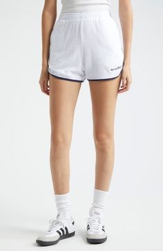 Plush cotton terry lends a luxe look and feel to these sporty shorts finished with contrast piping to underscore the vintage-inspired silhouette. Elastic waist 100% cotton Machine wash, dry flat Made in Portugal Asian & Pacific Islander Owned/Founded Sporty Cotton Shorts With Ribbed Waistband, White Cotton Shorts With Ribbed Waistband, Sports Bottoms With Contrast Trim In Short Length, Sports Bottoms With Contrast Trim, Sports Bottoms With Contrast Trim, Short Length, Sports Bottoms With Contrast Trim And Short Length, Sporty Bottoms With Contrast Trim In Short Length, Cotton Shorts With Contrast Trim, Sporty White Leisure Shorts