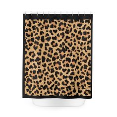 a shower curtain with an animal print pattern on the front and back of it,