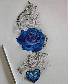 a drawing of a blue rose with a heart in the middle and some beads around it