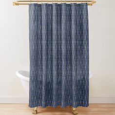 a blue shower curtain with white dots on it