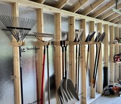 a garage filled with lots of tools and hanging on the wall next to each other