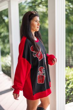 Black and red colorblock sweatshirt with red sequin football uniforms The most fab way to show off your Football Love! Black and red colorblock french terry knit sweatshirt, featuring red sequin football uniforms across the front. Too perfect!! This babe is stylish and comfy, making her a must-have all football season long! Loose relaxed fit Model is 5'3" & sized up to a large for a "dress" look. However, your normal size will still be a loose relaxed fit, just not quite as long! Ribbed crew nec Football Outfit, Colorblock Sweatshirt, Lounge Outfits, Football Love, Football Uniforms, Color Block Sweatshirt, Vintage Couture, Red Sequin, Knit Sweatshirt