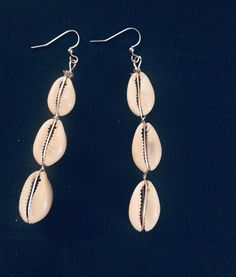 Beautiful Diva cowrie she'll hook dangle earrings. These earrings are the perfect accent to an upscale or dress down outfit. Accentuate you outfit with acuity real piece. Cowrie shells were used in ancient times as currency for trade. Summer Shell Dangle Jewelry, Silver Shell-shaped Earrings For Summer, Elegant Silver Jewelry For Beach Season, Trendy Beach Drop Earrings, Silver Earrings For Summer Vacation, Summer Vacation Teardrop Earrings, Casual Silver Earrings For Summer, Silver Casual Summer Earrings, Casual Silver Summer Earrings