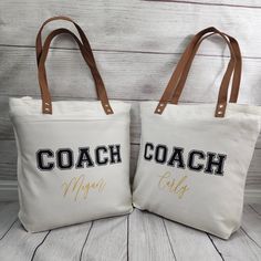 two canvas bags with coach and mom embroidered on them