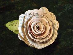 a flower made out of old book pages