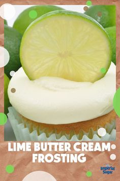 lime butter cream frosting on top of a cupcake with a slice of lime