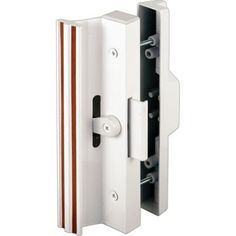 an image of a door handle and latch on a white wall mounted cabinet or cupboard