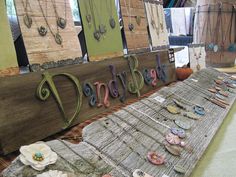 there are many different items on display at this craft show, including buttons and beads