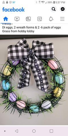 a black and white checkered wreath with painted eggs