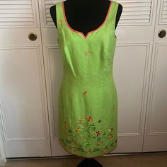 Dress Is Fully Lined, 100% Linen, Sleeveless, Trimmed In Orange, With Embroidered Flowers, V Neckline. Approximate Measurement Lying Flat Armpit To Armpit 17”, Hip 17”, Length 37”. Dress Has No Stretch. Fitted Sleeveless Dress With Floral Embroidery, Embroidered Fitted Sleeveless Dress, Green Cotton Sleeveless Dress For Spring, Green Embroidered Knee-length Dress, Spring Sleeveless Embroidered Cotton Dress, Fitted Sleeveless Dress With Floral Embroidery For Spring, Fitted Green Embroidered Dresses, Green Embroidered Sleeveless Dress, Spring Cotton Sleeveless Dress With Embroidery