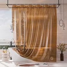 a bath room with a tub and a curtain