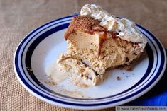 a piece of cake on a plate with whipped cream