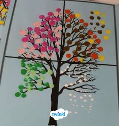 this is an image of a tree made out of colored circles on a sheet of paper