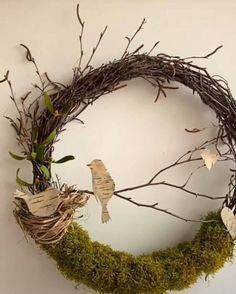 a wreath made out of twigs and moss