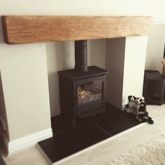 a wood burning stove sitting inside of a living room