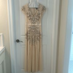 a dress hanging on a door in a room