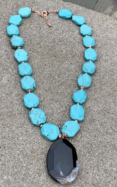 Back to Blue Turquoise Magnesite & Agate Pendant Necklace Barse Genuine Agate Genuine Turquoise Magnesite Genuine Hematite & Copper Genuine Bronze Lobster Clasp Closure Crafted and Finished By Hand CCRUN03MUC Approximate Measurements: Length- 16"-18"+ 2" Extender; Pendant Slab Slice- 1 3/4" Live your life in color with this beautiful statement pendant necklace. Pair this with a simple white V-neck t-shirt, white jeans, a denim jacket and you will be ready for a night out on the town with Turquoise Agate Gemstone Beaded Necklaces, Turquoise Agate Beaded Necklace, Turquoise Agate Beaded Necklace With Gemstones, Turquoise Agate Gemstone Beaded Necklace, Turquoise Agate Jewelry With Large Stone, Blue Chrysocolla Necklace With Stones, Blue Agate Stone Necklaces, Turquoise Gemstone Crystal Necklaces For Jewelry Making, Blue Chrysocolla Necklace With Large Stone