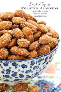 a blue and white bowl filled with almonds