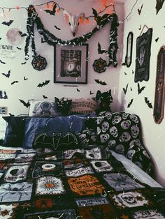 a bed covered in lots of halloween decorations