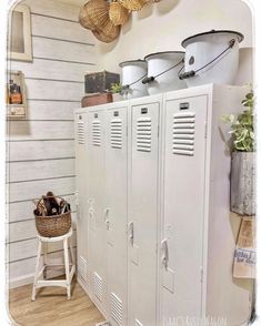 a room with two lockers and some baskets on the wall next to it,