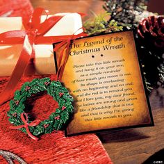 the legend of the christmas wreath is displayed next to a card with a poem on it