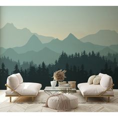 a living room with mountains and trees painted on the wall