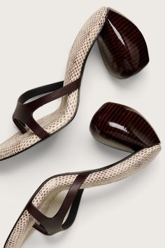 A stamped snakeskin leather sandal in Espresso hued with a sculptural heel. • Sculptural heel• Stamped faux snakeskin leather sole• Smooth leather straps Luna Sandals, Unique Heels, Fly Shoes, Clear Shoes, Luxury Designer Shoes, Statement Shoe, Snakeskin Heels, Pointed Heels, Cult Gaia