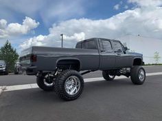 a large gray truck parked in a parking lot