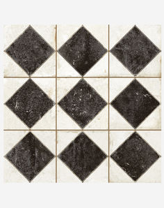 black and white tile with diamond shapes on the bottom, in various sizes and colors