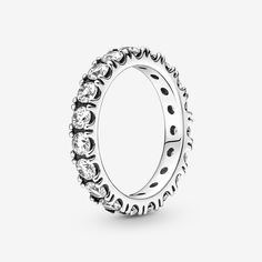 Make a classic statement with the Sparkling Row Eternity Ring. Hand-finished in sterling silver, this eternity ring features a band inlaid with sparkling clear man-made cubic zirconia. The design looks equally beautiful worn solo or stacked with other rings. Style it with bands in similar tones to create a monochromatic look, or go for contrasting metals for a combination that pops. This ring is designed to be a wardrobe essential for years to come. - Pandora Sparkling Row Eternity Ring - Sterling silver / Cubic Zirconia / Clear - Sz. 7.5 Pandora Stackable Rings, Ring Pandora, Rings Style, Bracelet Pandora, Ring Hand, Bracelet Charms, Pandora Bracelet Charms, Jewellery Uk, Pandora Bracelet