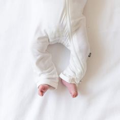 Finding the perfect sleep-to-play outfit has never been easier than with a zippered romper from Kyte Baby. This piece is great for all-day wear but also meets all safe sleep requirements from the American Academy of Pediatrics for cozy nights. With stretchy material for wiggly babies and dual zippers for quick changes, this zippered romper helps your little one stay comfy all day and night. Our rayon made from bamboo is buttery soft and hypoallergenic, even helping to alleviate signs of eczema i Kyte Baby, Play Outfit, Baby Layette, Closet Essentials, Baby Grows, Rich Colors, Baby Soft, Baby Romper, A Rainbow